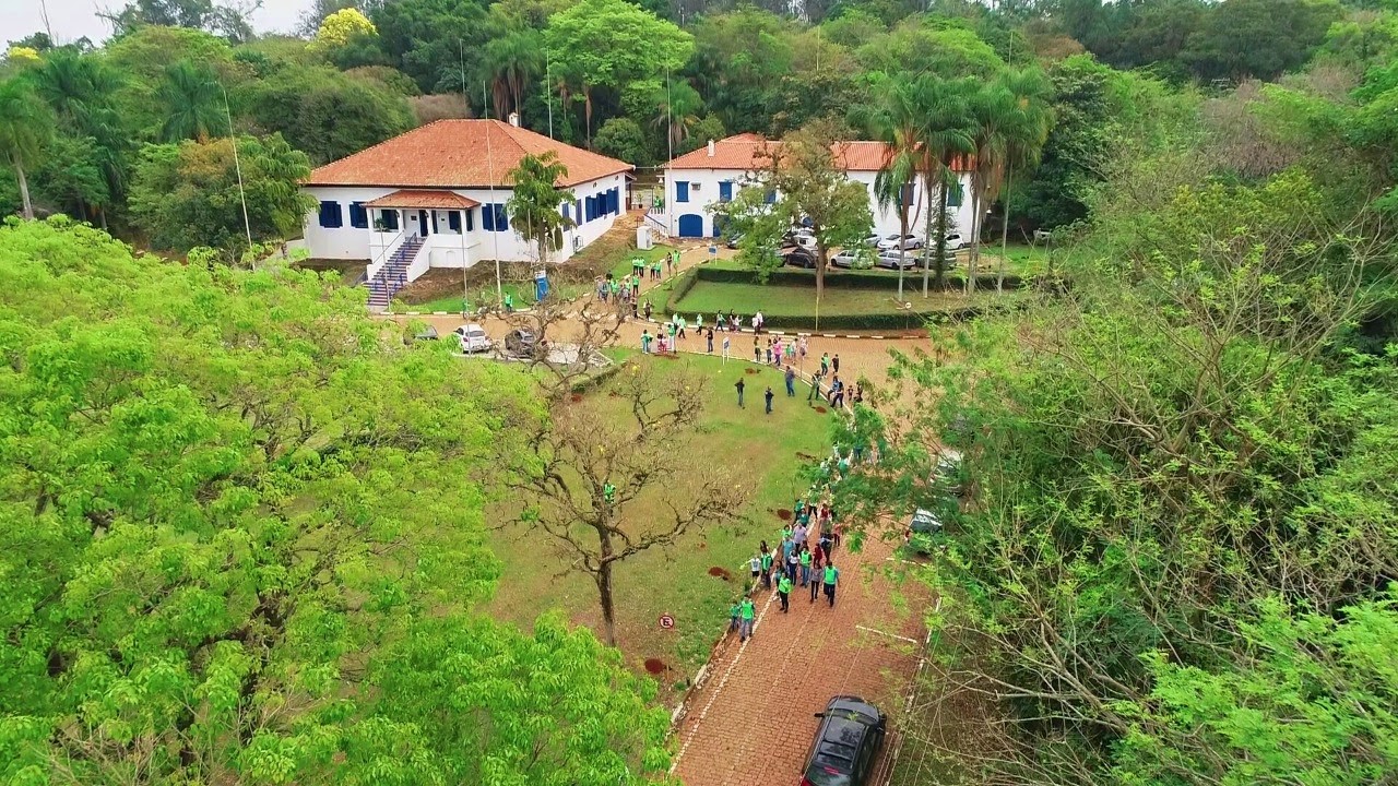 Aerial photo of the Paulinia site with people gathered outside.